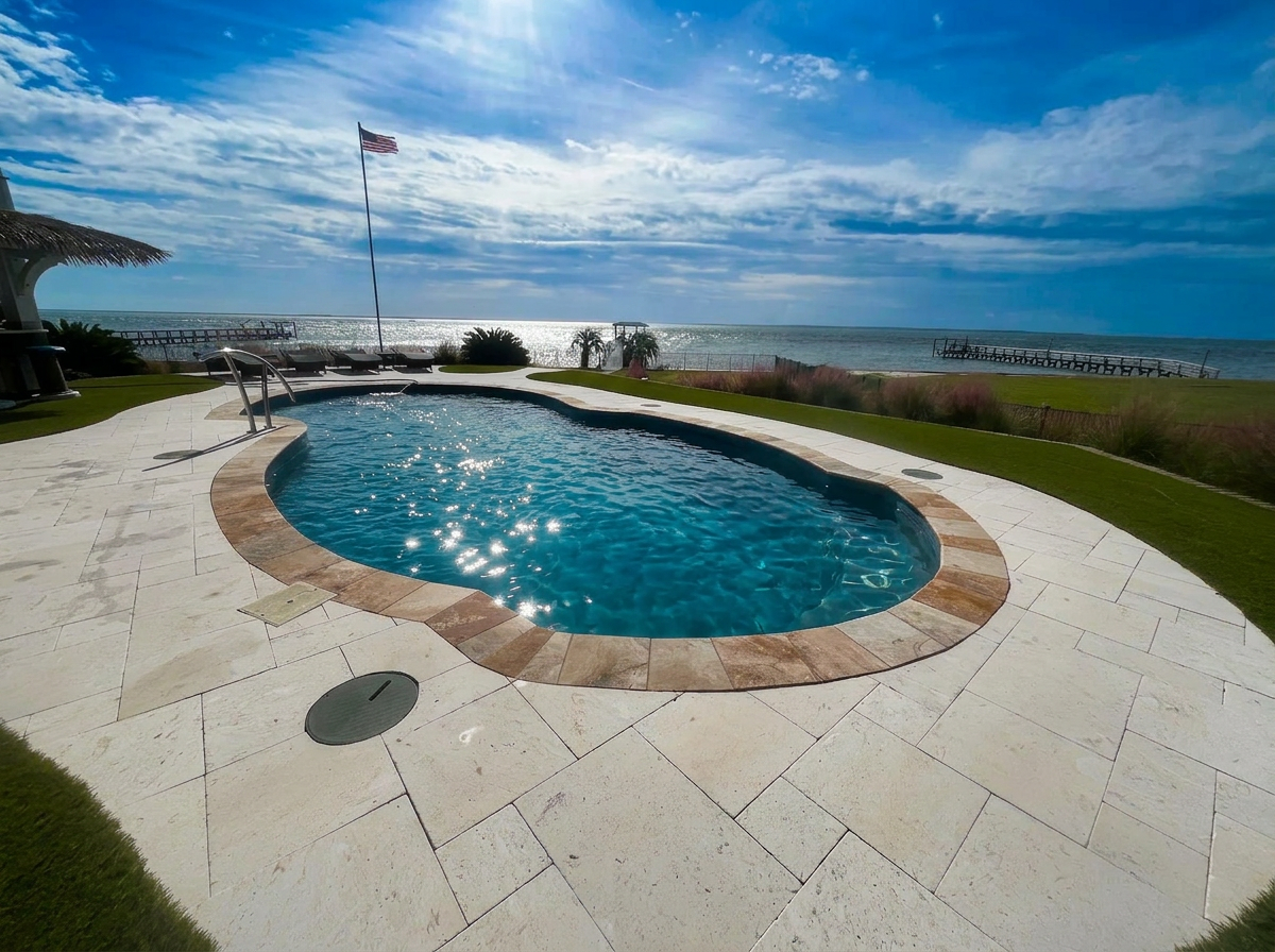 Oceanfront pool with travertine deck